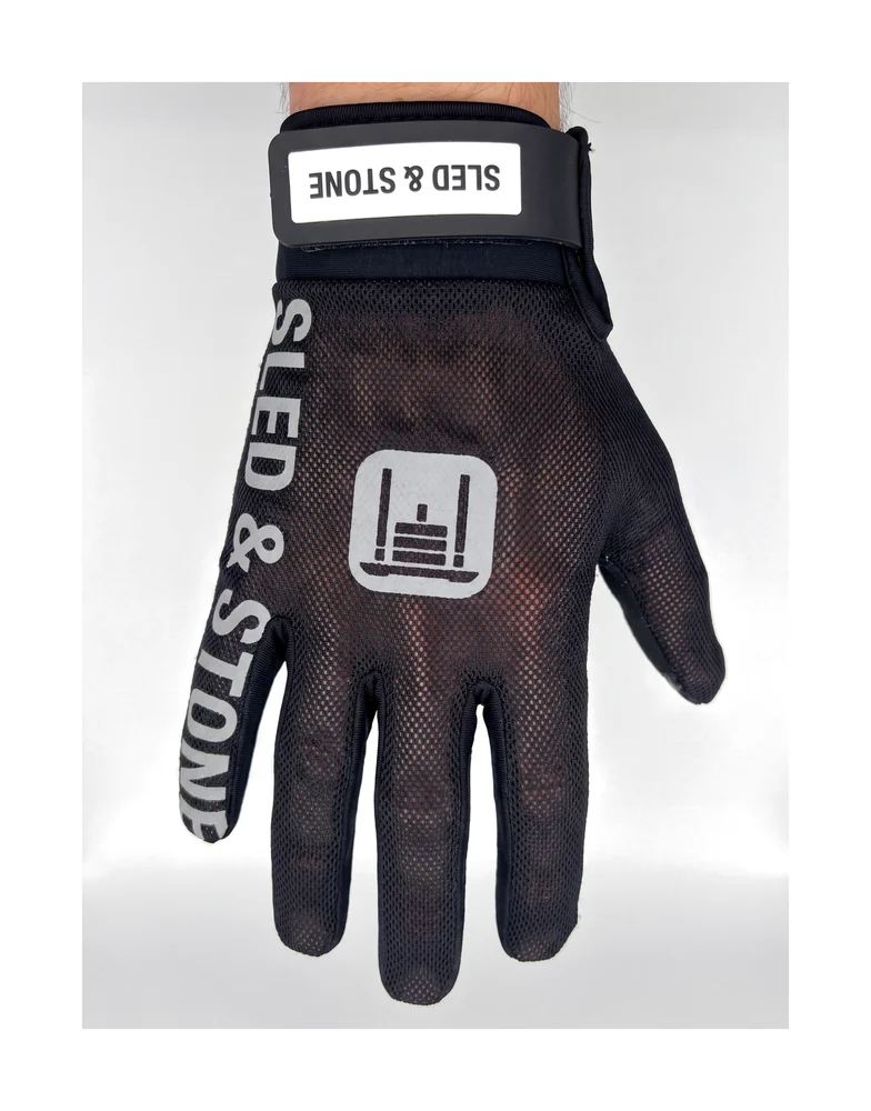 Back of the Sled & Stone HYROX glove: breathable mesh, sled mark, and the wordmark down the pinky edge