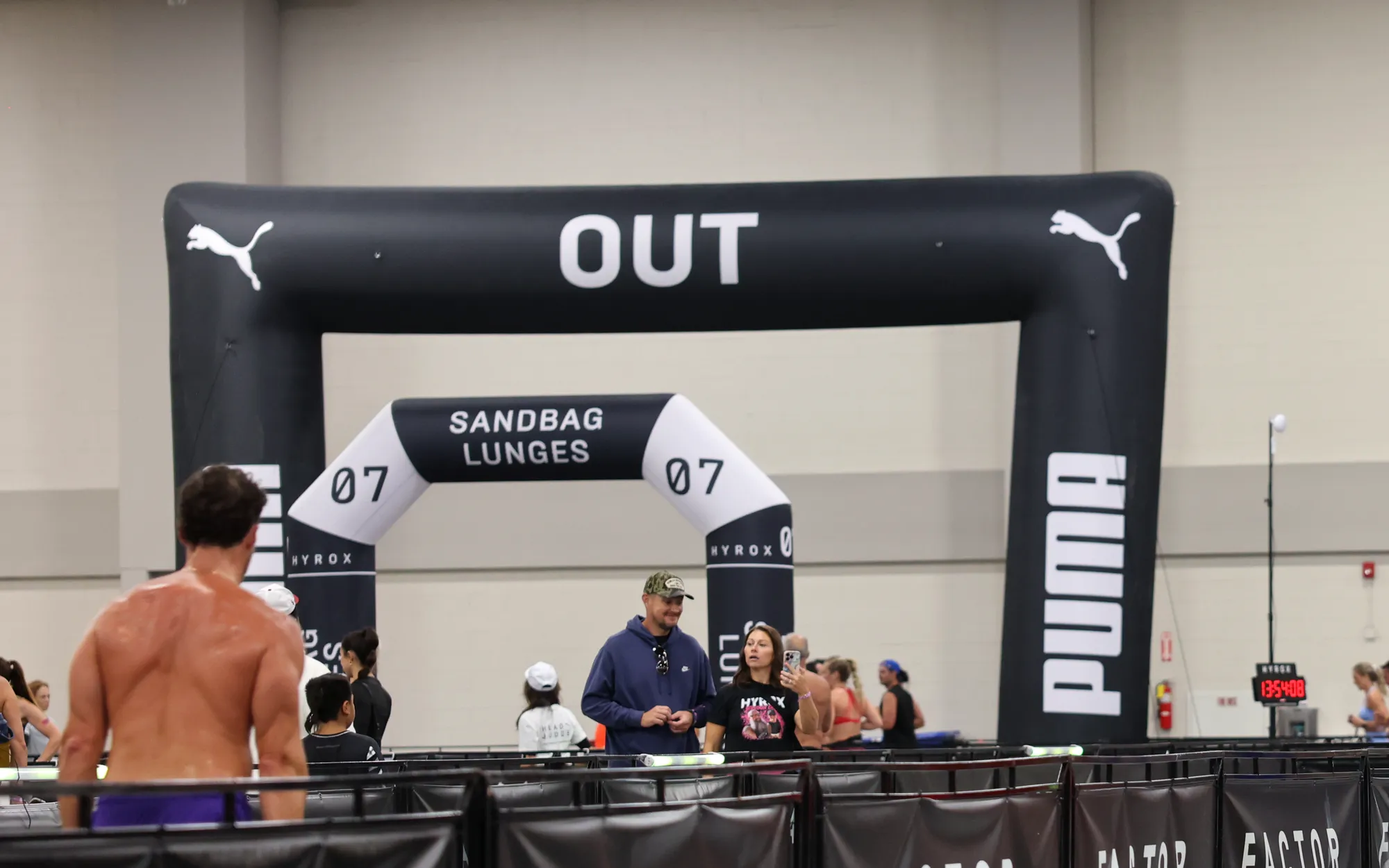 The Roxzone OUT arch at HYROX Salt Lake City, with the sandbag lunges arch behind it
