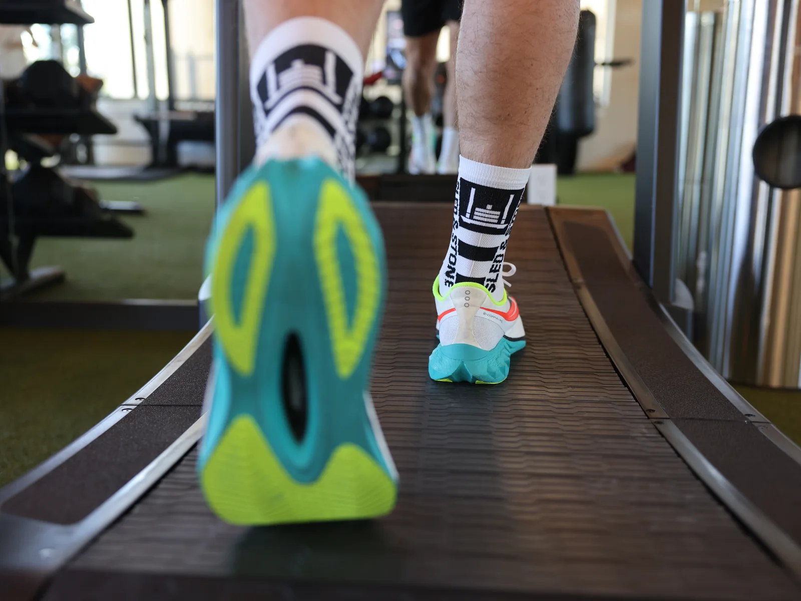 The Updraft race sock in white with black, Sled & Stone knitted down the cuff — view 4